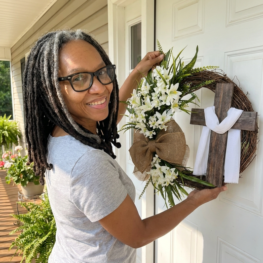 Michelle hanging the wreath on her front door
