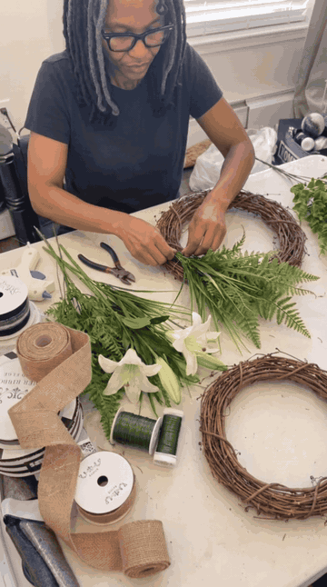 Wiring greenery onto the grapevine base
